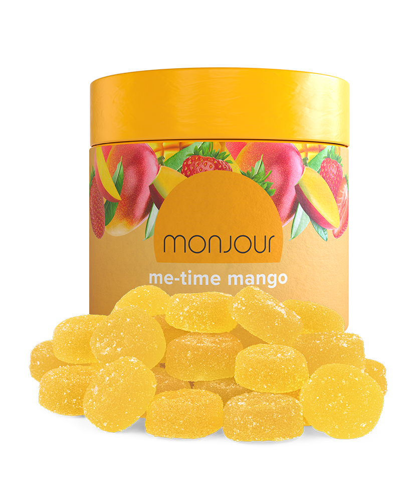 A yellow jar of Monjour Me-Time Mango with a pile of gummies.